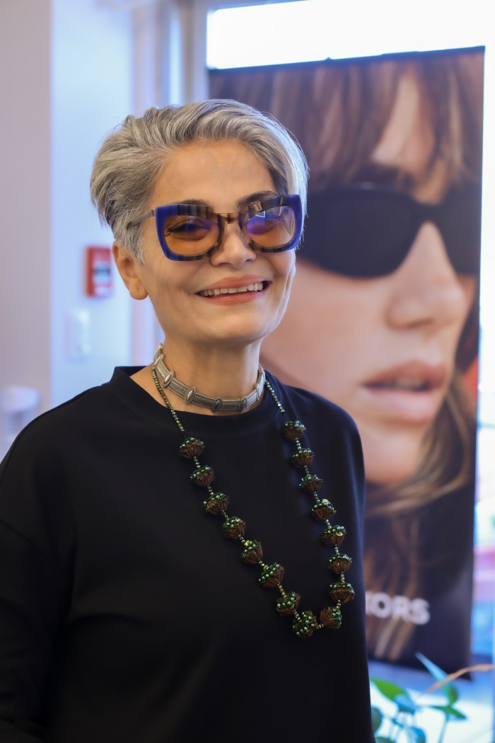 Branding Photography in Newmarket – Optical Store Customer with Glasses